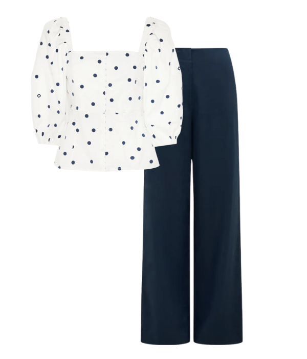 navy blue pants and white puff sleeve top with polka dots