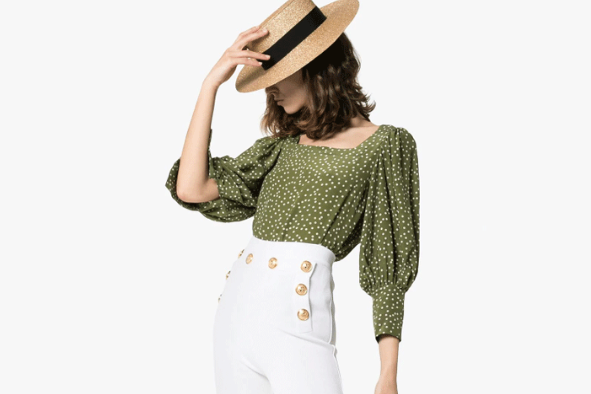 girl wearing a straw boater, white pants and green puff sleeve top