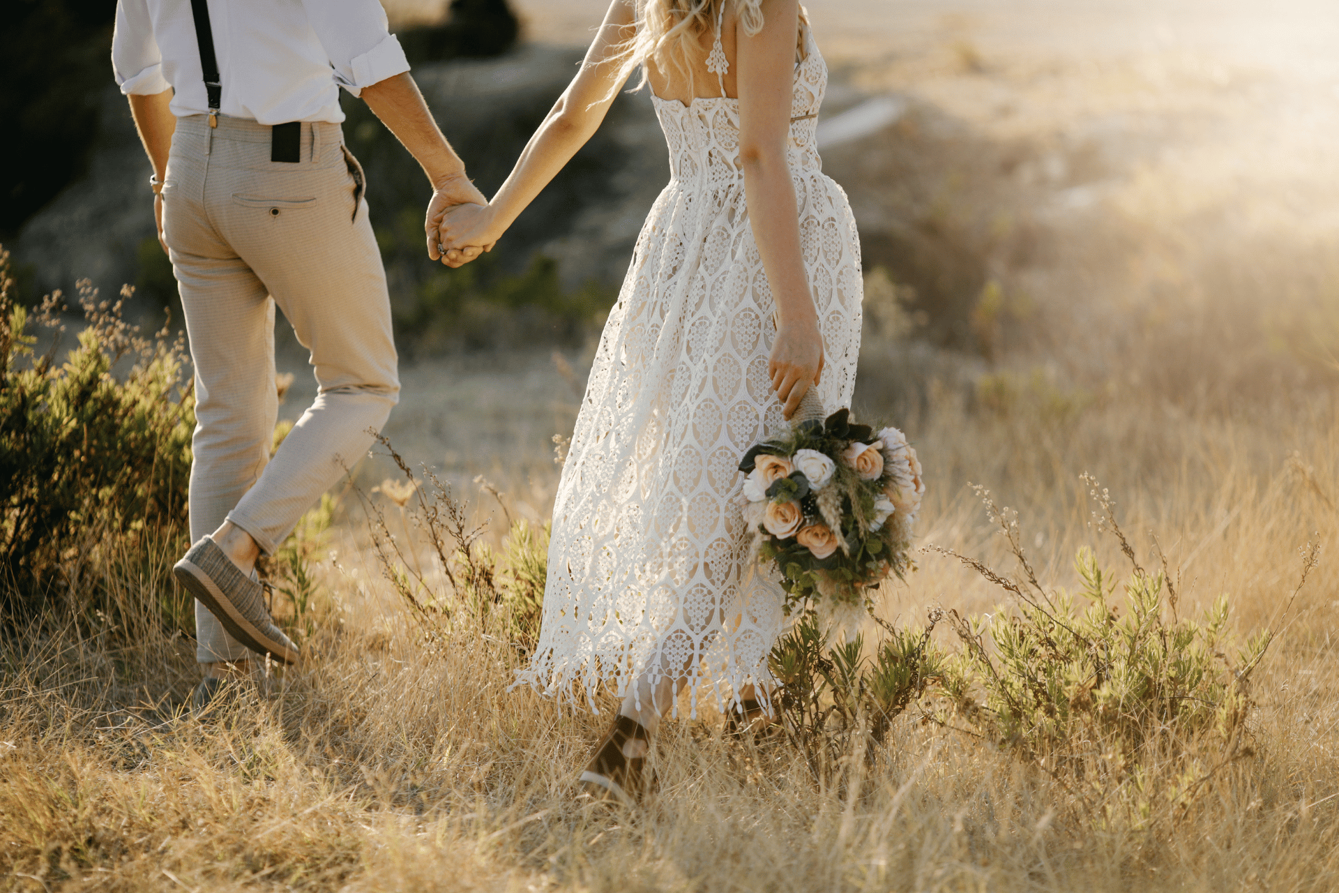 rustic wedding image of a bride in a white lace dress and groom