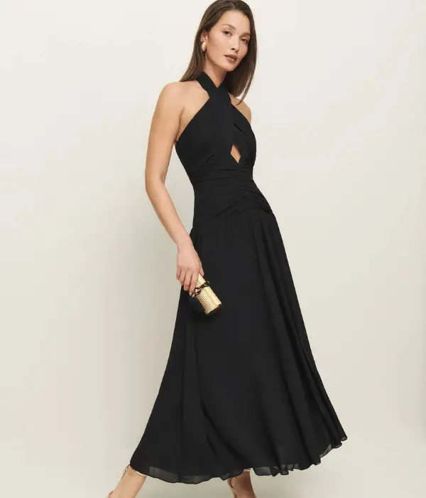model wearing black dress with a halterneck
