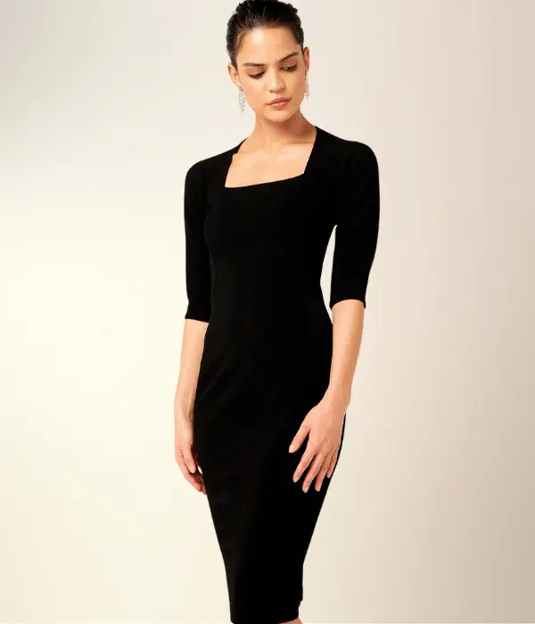 model wearing a straight black dress with a square neckline