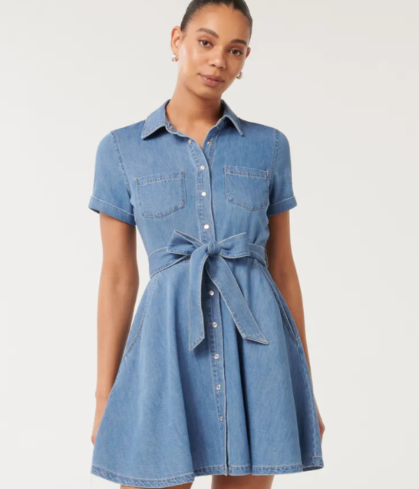 model wearing a light blue denim shirt dress