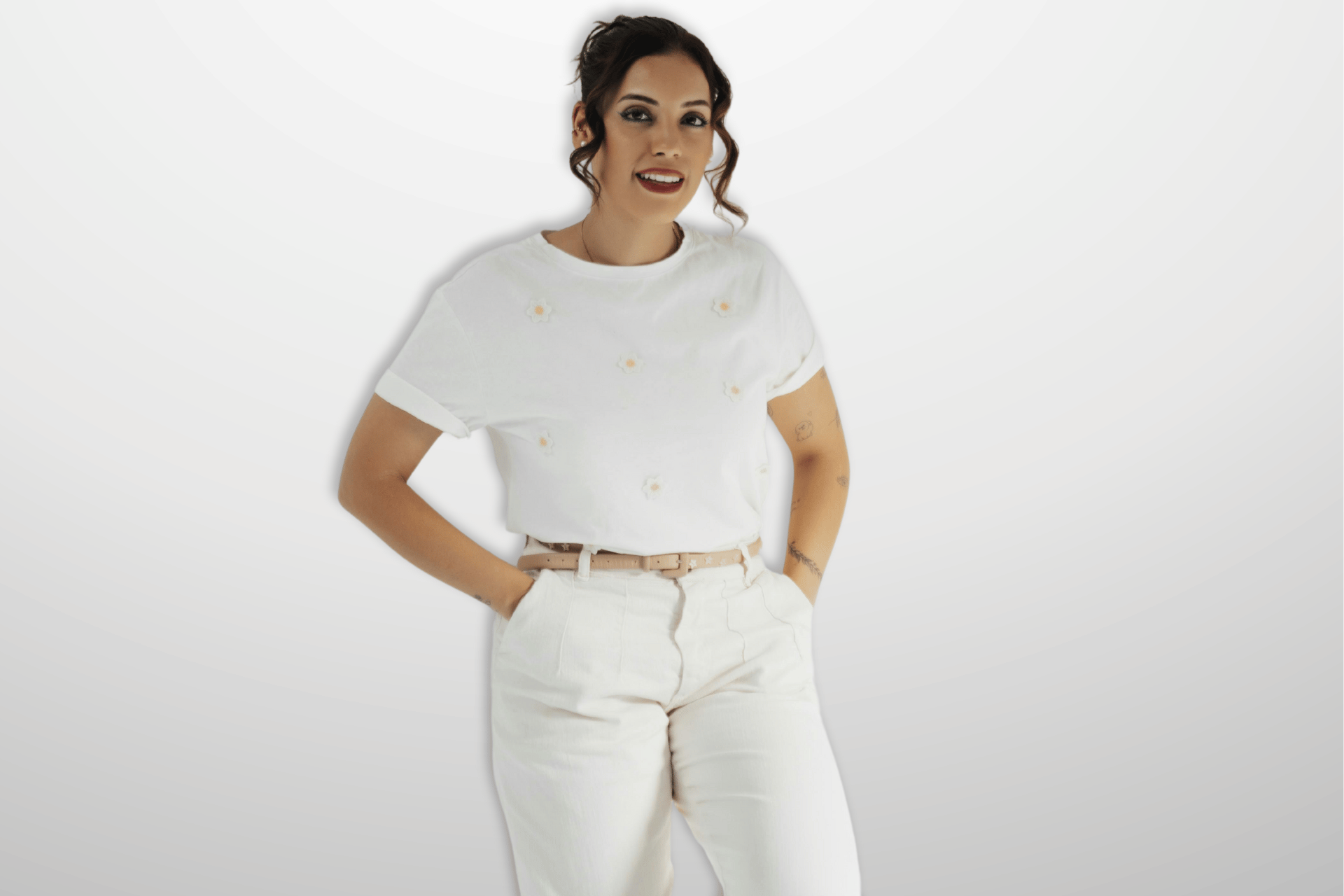 lovely curvy woman wearing white t-shirt and light coloured pants