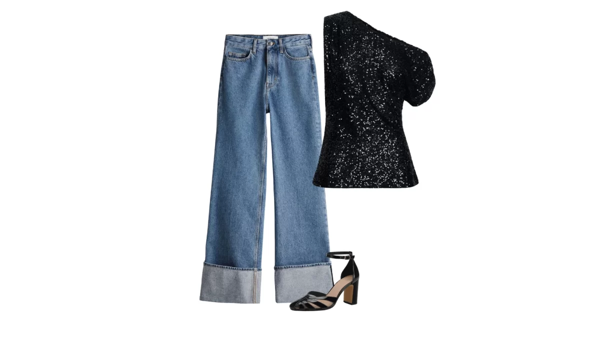 cuffed hem blue jeans with a black one shoulder top and black pumps