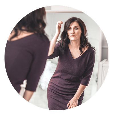 woman looking in the mirror