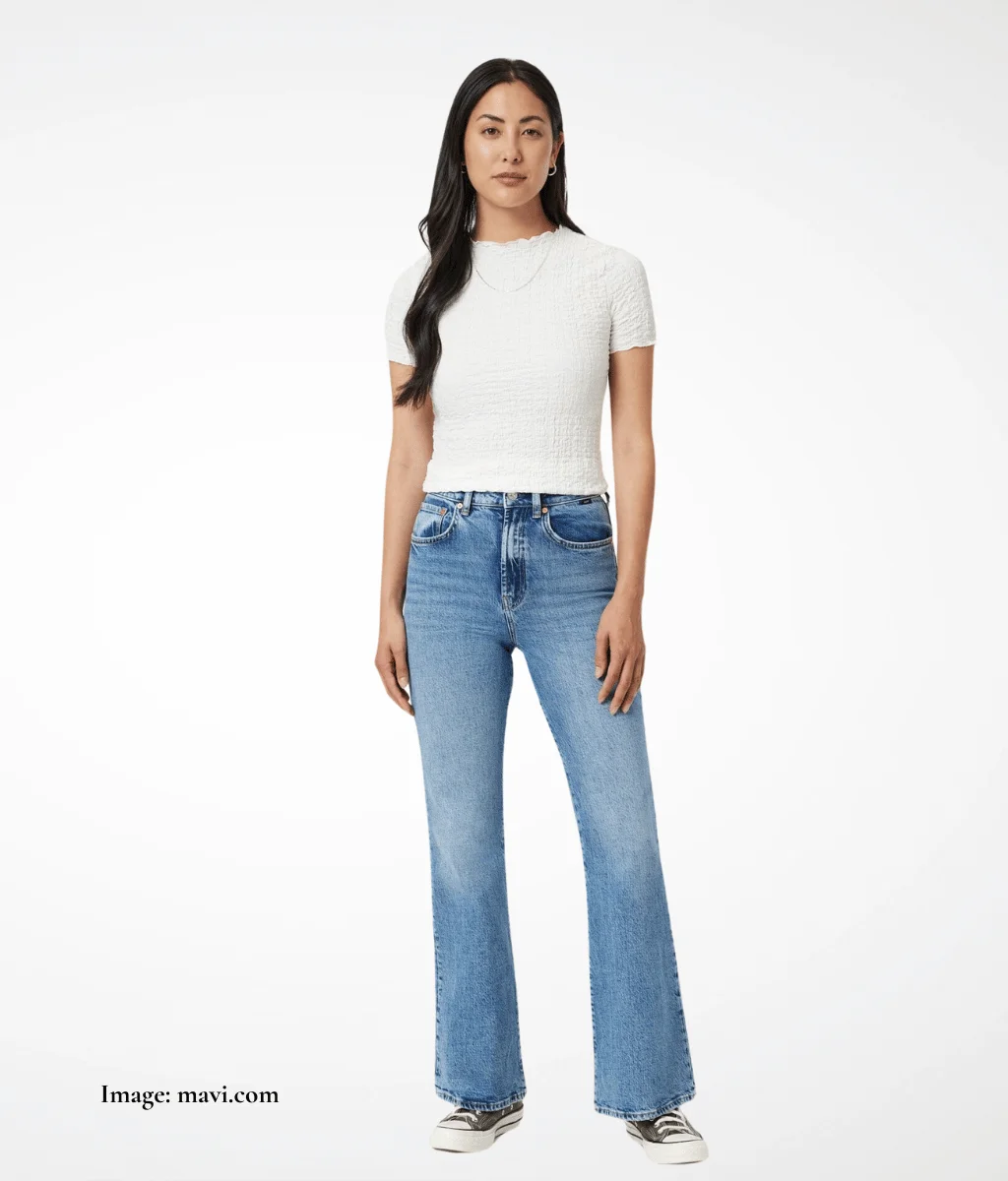model wearing light coloured blue jeans and a white t-shirt