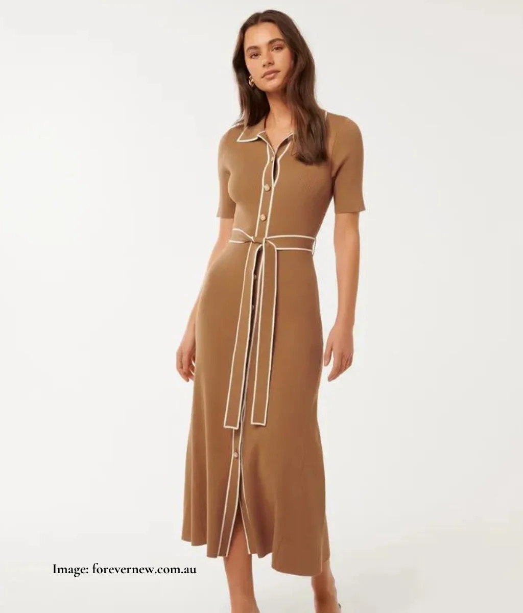 beige and white dress with a belt and collar, buttons down the front