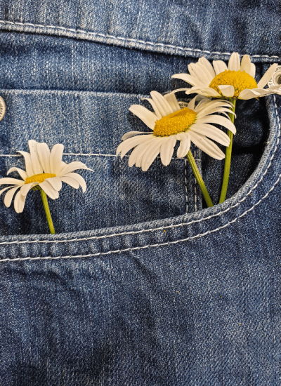 image of blue denim pocket with white daisies